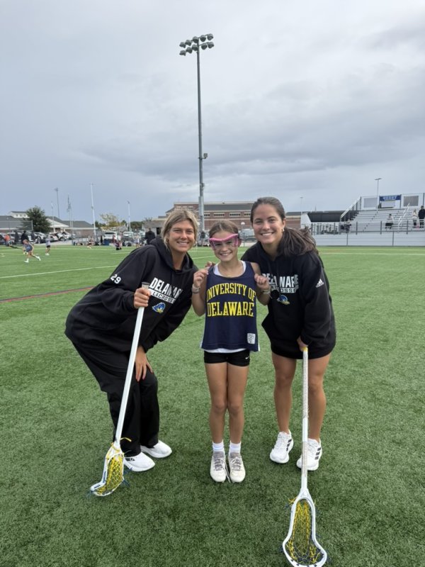 Kennedy Radziul, Evan Chubb andLena Stolarick pause for a photo during the fall lacrosse clinic.